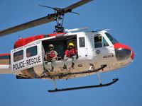 N233JP @ VGT - LVMPD /  Bell HH-1H - They don't look like they're very happy about the picture. - by SkyNevada - Brad Campbell