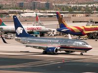 N906AM @ PHX - Photo taken from the Terminal 3 parking garage - by John Meneely