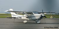 N379MA @ ECG - A visitor from afar, gleaming in the sun - by Paul Perry