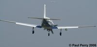 N822DK @ PVG - Over the numbers, and coming down.  Decent view of the pod under the starboard wing - by Paul Perry