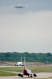 PH-MCU @ STN - On final with 1 departure ahead. - by Andy Graf-VAP