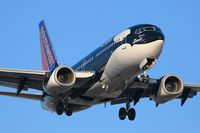 N715SW @ LAX - Southwest Airlines N715SW Shamu (FLT SWA563) from Metropolitan Oakland Int'l (KOAK) on final approach to RWY 24R. - by Dean Heald