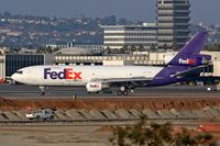 N313FE @ LAX - Fed Ex N313FE (FLT FDX3706) exitting RWY 25R after arrival from Indianapolis Int'l (KIND). [Canon 30D, Canon 300mm f/2.8L IS] - by Dean Heald