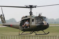 N354HF @ KDAY - Huey giving rides - by Florida Metal