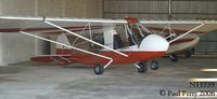 N11739 @ W03 - One of the two Challengers tucked away in a hangar - by Paul Perry