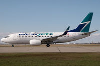 C-FWCN @ CYYC - Westjet Boeing 737-700 - by Yakfreak - VAP