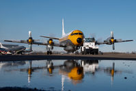 C-GZVM @ CYQF - Air Spray Lockheed Electra - reflection - by Yakfreak - VAP
