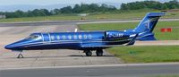 G-JANV @ EGCC - Learjet 45 shines in bright sun - by mike bickley