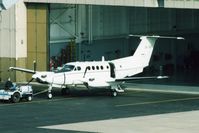 84-24380 @ CID - C-12D being towed out of the Rockwell-Collins hangar, seen from the tower with a 600mm lens - by Glenn E. Chatfield
