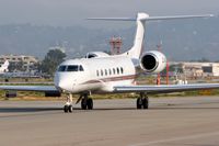 CS-DKC @ VNY - NetJets Europe CS-DKC taxiing to RWY 16R for departure to Serbia. - by Dean Heald