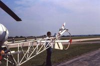 N70SU @ OSU - Bell OH-13F 59-4928, with the Ohio State University Flight Department.  That's me preflighting to take my wife up over Columbus - by Glenn E. Chatfield
