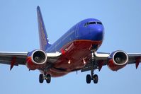 N910WN @ LAX - Southwest Airlines N910WN (FLT SWA154) from San Jose Int'l (KSJC) on short-final to RWY 24R. - by Dean Heald