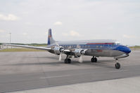 N996DM @ VIE - Red Bull DC6 - by Yakfreak - VAP