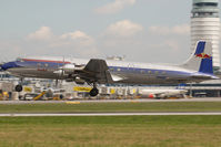 N996DM @ VIE - Red Bull Douglas DC6 - by Yakfreak - VAP