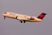 N818CA @ ORF - Delta Connection (Comair) N818CA (FLT COM588) climbing out from RWY 5 enroute to New York John F Kennedy Int'l (KJFK). Seen here in new Delta colors. - by Dean Heald