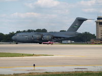 98-0056 @ KOFF - GREG POE'S PLANE IS DWARFED BY THIS HUMUNGUS TRANSPORT - by Gary Schenaman