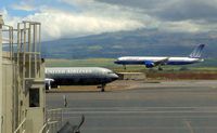 N669UA @ PHOG - Two united. One at hold-short, the other on very short final. - by Victor Agababov