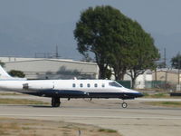 N254CL @ KVNY - Lacy Lear taking off RWY 16R - by Chris Allegro