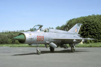 8819 @ EPOK - In 2002 the MiG-21 was withdrawn from navy use. This one was rolled outside its storage for a media event. - by Joop de Groot
