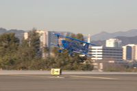 N540BE @ SMO - 540BE on very short final - by Curt Sletten