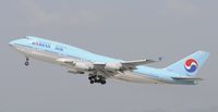 HL7491 @ KLAX - Departing LAX on 25R - by Todd Royer