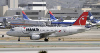 N318NB @ KLAX - Taxi to gate - by Todd Royer
