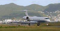 N90AM @ TNCM - taxing runway 10 - by daniel jef