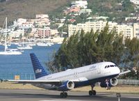 N656JB @ TNCM - take off runway 09 - by daniel jef