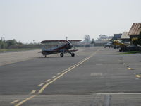 N32135 @ SZP - 1941 Waco UPF-7, Continental W670 220 Hp, a stunning showplane, taxi off Rwy 22 - by Doug Robertson