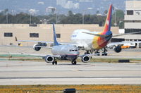 N398UA @ KLAX - United Airlines Shuttle Boeing 737-322, N398UA taxiing KLAX. - by Mark Kalfas