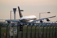 9V-SKA @ EGLL - Touching down rwy 27R - by Florian Seibert
