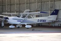 G-BFMX @ EGBO - Part of a busy aviation scene at Wolverhampton (Halfpenny Green) Airport on a crisp winters day - by Terry Fletcher
