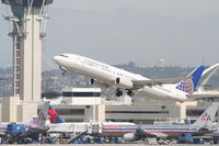 N39415 @ KLAX - Continental Airlines Boeing 737-924, COA16 to KEWR, departing 25R KLAX. - by Mark Kalfas