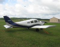 N5738W @ Y50 - Piper PA-28-150 Cherokee in the grass. - by Kreg Anderson