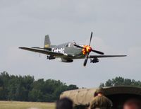 N551E @ YIP - Roush's P-51B Old Crow flying low over WWII reinactors - by Florida Metal