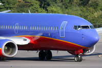N751SW @ ORF - Southwest Airlines N751SW (FLT SWA3056) on taxiway Echo turning onto taxiway Charlie after arrival from Jacksonville Int'l (KJAX) on RWY 5. The reflections on the side of the aircraft are mesmerizing. - by Dean Heald