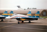 102 @ EGVA - MiG-29A Fulcrum of the Ukranian Falcons display team on the flight-line at the 1997 Intnl Air Tattoo at RAF Fairford. - by Peter Nicholson