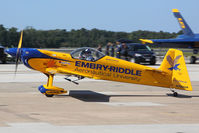 N580GP @ NTU - Matt Chapman acknowledges the crowd's appreciation of his spectacular aerobatic performance as he taxis before them. - by Dean Heald