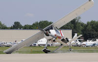 N7080D @ KOSH - Recovered with no further inccident, removed paint on the tip of the wing and horizontal tail and damaged right main gear. - by Todd Royer