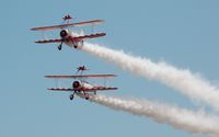 N74189 - Off airport. Team Guinot, deux/2 lead by N707TJ (trois/3) at the Wales National Airshow, Swansea Bay, Wales, UK. - by Roger Winser