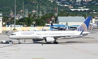 N21108 @ TNCM - Continental N21108 being push back from the gates at TNCM - by Daniel Jef