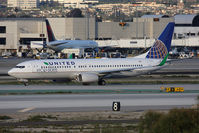 N76516 @ LAX - United Airlines Eco Skies N76516 (FLT COA17) on Taxiway Papa holding short of RWY 25R after arrival from Newark Liberty Int'l (KEWR) on RWY 25L. New United titles. - by Dean Heald