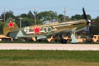 N1157H @ KOSH - Departing Airventure 2011. - by Bob Simmermon