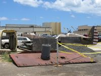 UNKNOWN @ NPS - A P-40 fuselage just sitting on the side of the hangar. You do NOT see that every day! - by Kreg Anderson