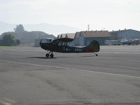 N354X @ SZP - 1957 Cessna L-19E BIRD DOG, Continental O-470-11B 213 Hp. NOTE: This aircraft of stunning appearance and authentically marked is 1957 manufacture first FAA-registered in 1983, taxi off the active after STOL landing Rwy 22 - by Doug Robertson