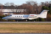 N143AA @ ORF - Anton Air LLC 1998 Bombardier Learjet 60 N143AA back-taxiing on RWY 5/23 prior to departure to McClellan-Palomar (KCRQ). Aircraft used the call-sign Starbase 143 when communicating with ATC. - by Dean Heald