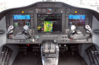 N967CM @ KOSH - Nice glass cockpit. - by Connector