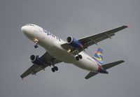 N604NK @ MCO - Spirit A320 with storm approaching - by Florida Metal