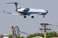 N740SK @ KORD - SkyWest/United Express Bombardier CL-600-2C10, SKW5545 arriving Edmonton Int'l /CYEG, on short final for RWY 14R Chicago O'Hare/KORD. - by Mark Kalfas