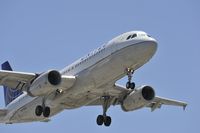 N443UA @ KLAX - Arriving at LAX on 24R - by Todd Royer